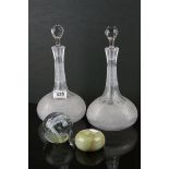 A pair of antique cut glass part hobnail decanters together with two paperweights.