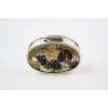 A silver and enamel lidded pill box with pictorial image of Dogs