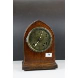 Early 20th century 8 Day Mantle Clock contained in an Oak Arched Case with Brass Face, 30cms high