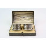 A pair of fully hallmarked sterling silver napkin rings in original presentation box.