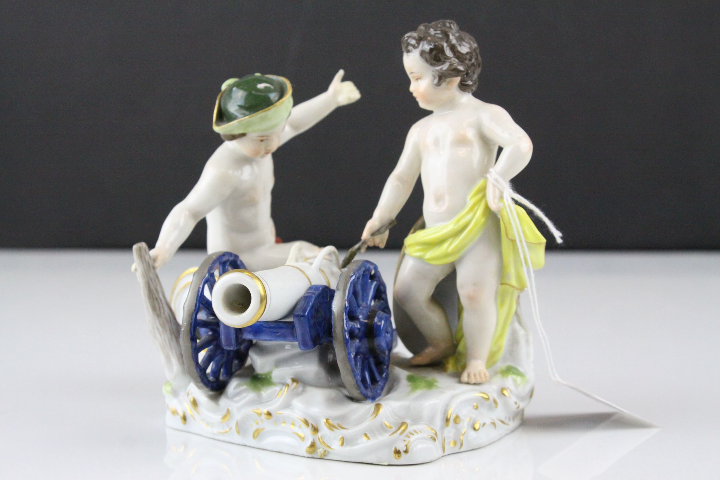 Meissen Porcelain Figure Group of Two Children / Infants firing a Cannon, the base decorated with