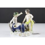 Meissen Porcelain Figure Group of Two Children / Infants firing a Cannon, the base decorated with