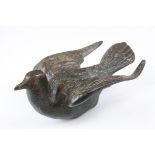 A bronze figure of a bird possibly a dove early 20th century.