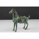 Chinese Tang Style Metal Horse with patinated finish, 19cms long