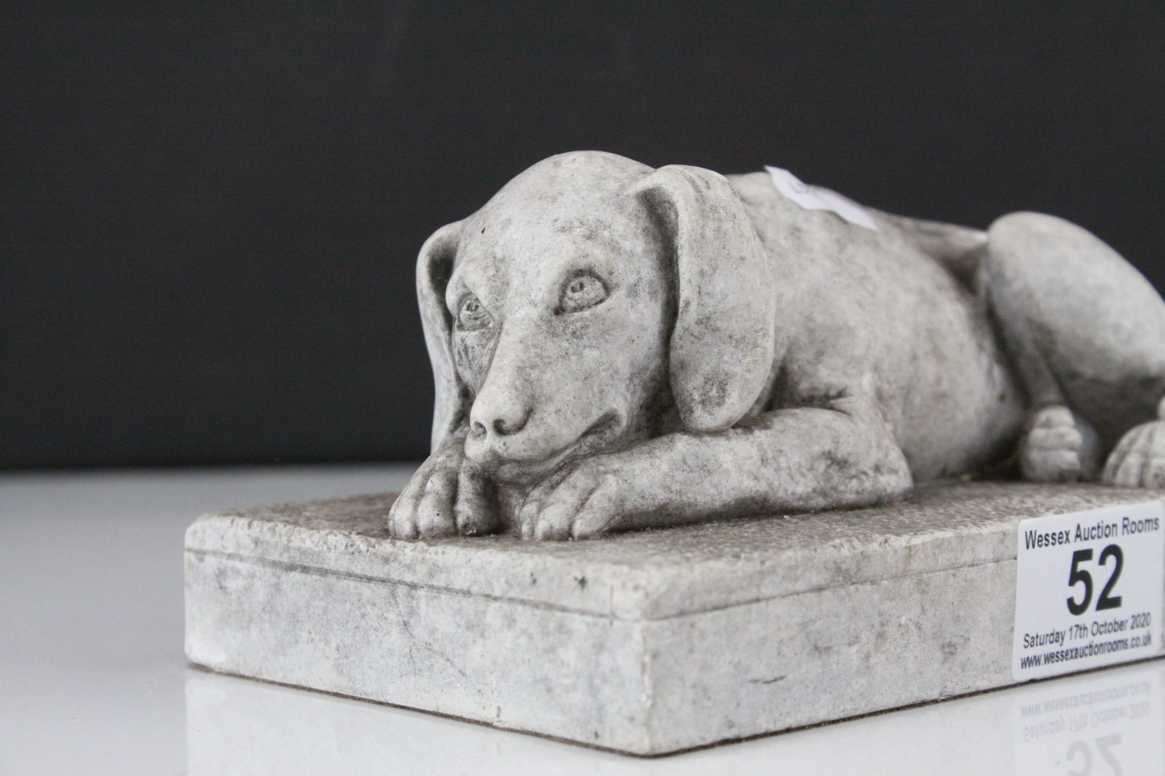 A stone effect scuplture of a recumbent dog. - Image 2 of 4