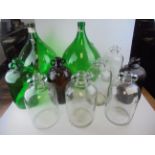 Two Large Green Glass Bottles, 54cms high together with Eight Demi-Johns (clear, brown and green