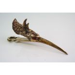 An unusual brass figural clip in the form of a water bird
