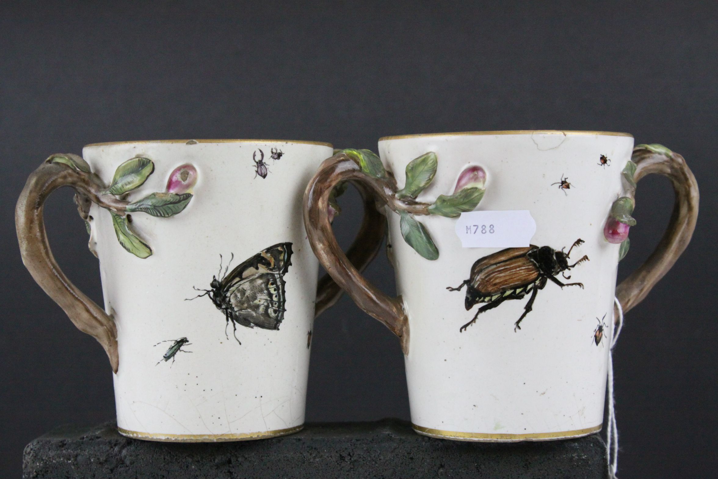 Pair of 19th century Continental Glazed Stoneware Twin Handled Mugs, the handles in the form of