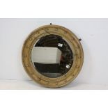 Regency Style Circular Mirror contained in an Oak ball decorated frame, 63cms diameter