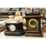 An early 20th century two train movement slate mantle clock together with a similar oak cased