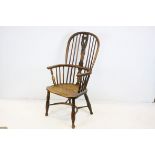 19th century Elm Seated Hoop and Stickback Country Elbow Chair with Crinoline Stretcher, 107cms