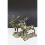 A pair of brass stags deer ornaments.