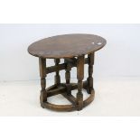 17th century Style Oak Oval Side Table raised on a cross-over base with turned and block supports,
