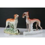 A pair of antique staffordshire greyhounds with hare.