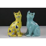 In the manner of Galle, A Mosanic Pottery Seated Cat, glazed in yellow with blue painted hearts