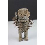 Carved Wooden Voodoo Doll, tribal figure holding a spear with nails in his body and arms, height