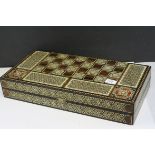 Two Wooden Games Boxes inlaid with bone and mother of pearl, each containing draughts pieces and