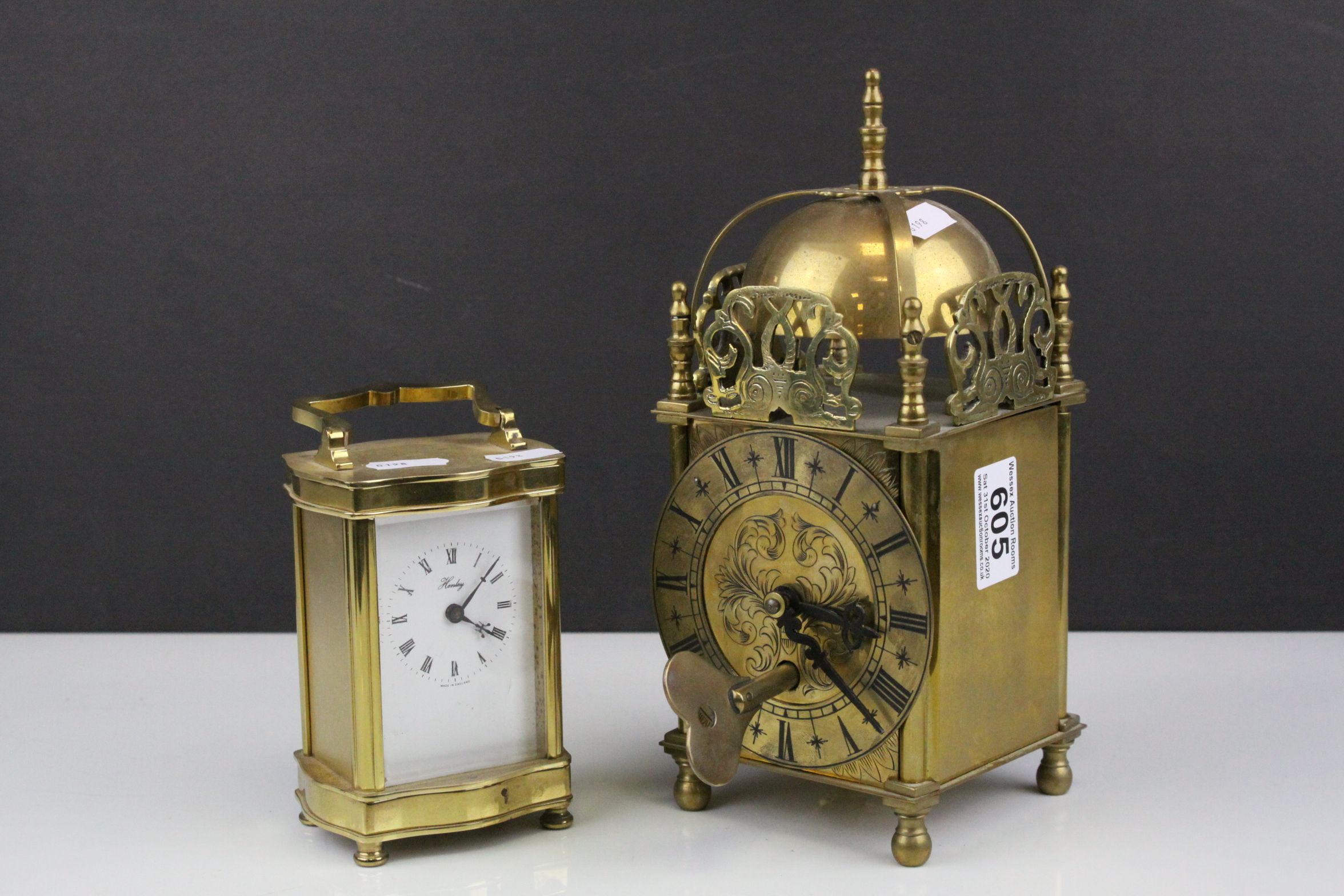 Gilt Brass 17th century Style Lantern Clock together with a Gilt Brass Cased ' Henley ' Battery