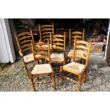 Set of Six Oak Ladderback Dining Chairs with Rush Seats (including two carvers)