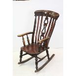 Elm Seated Lathe Back Windsor Elbow Rocking Chair, 105cms high
