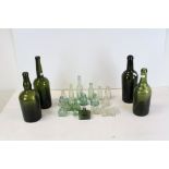 Four Antique Green Glass Bottles together with other Clear and Green Glass Ink Bottles etc
