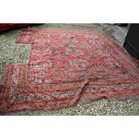 Large Wool Red Ground Rug (section cut out to side), max size 340cms x 375cms