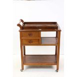 Chinese Hardwood Serving Trolley with lift out tray and two drawers, raised on castors, 74cms long x