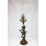 Late 19th century Bronzed Spelter Oil Lamp, the column in the form of a Cherub holding the floral