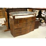 Early 20th century Walnut Bijouterie Cabinet of Serpentine form, the glazed top with pull-out