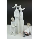 Three Lladro Figures including Pair of Nuns, 34cms high, Girl holding Candle and a Boy with Bird