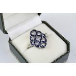 Art Deco style blue enamel and diamante white metal ring, scalloped border