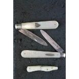Three mother-of-pearl handled silver bladed folding fruit knives, one with engraved ivy leaf and