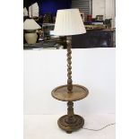 Oak Standard Lamp with Wine Shelf, the barley-twist column with acanthus leaf carving, 150cms high