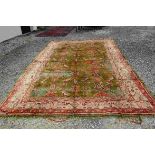 Large Wool Green, Pink and Cream Ground Rug with stylised pattern, 445cms x 280cms