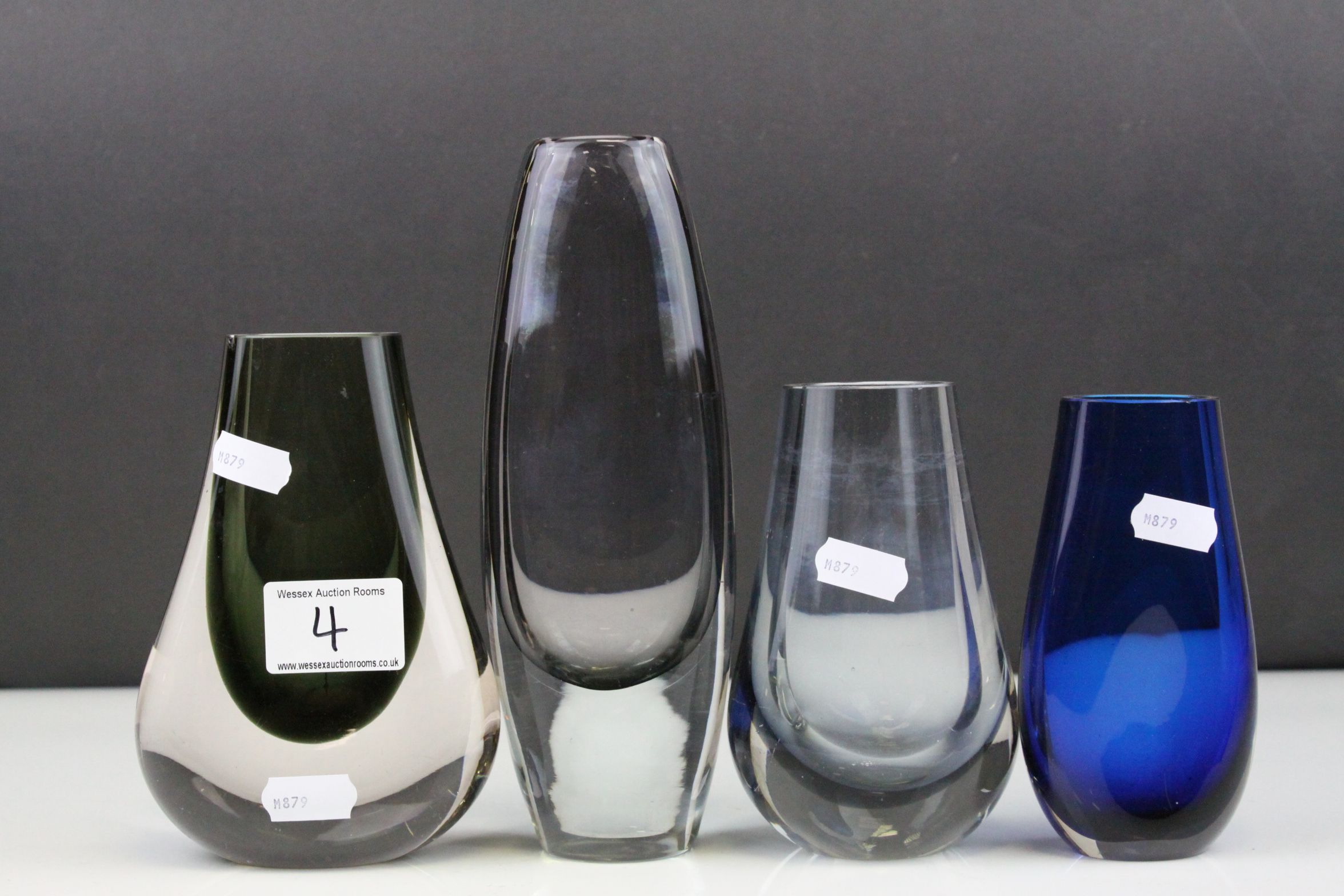 Three Whitefriars Smokey Glass Vases, tallest 20cms high together with a Studio Blue Glass Vase