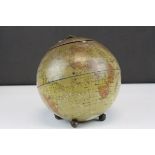 Tin Plate Biscuit Barrel in the form of a Globe, raised on three ball feet, 18cms high