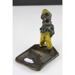 Austrian Novelty Spelter Ashtray and Matchholder in the form of a Boy smoking, cold painted,