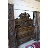 19th century Heavily Carved Oak Double Bedstead, carved throughout including face masks and