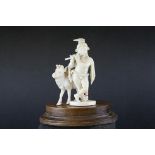 19th century ivory figure group depicting mythical semi nude piper with long flowing hair, bead