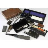 Collection of items to include vintage leather case, cut throat razor, surgical instruments, two