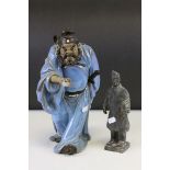 A clay chinese warrior style figure and a similar figure of a bearded warrior in blue costume.
