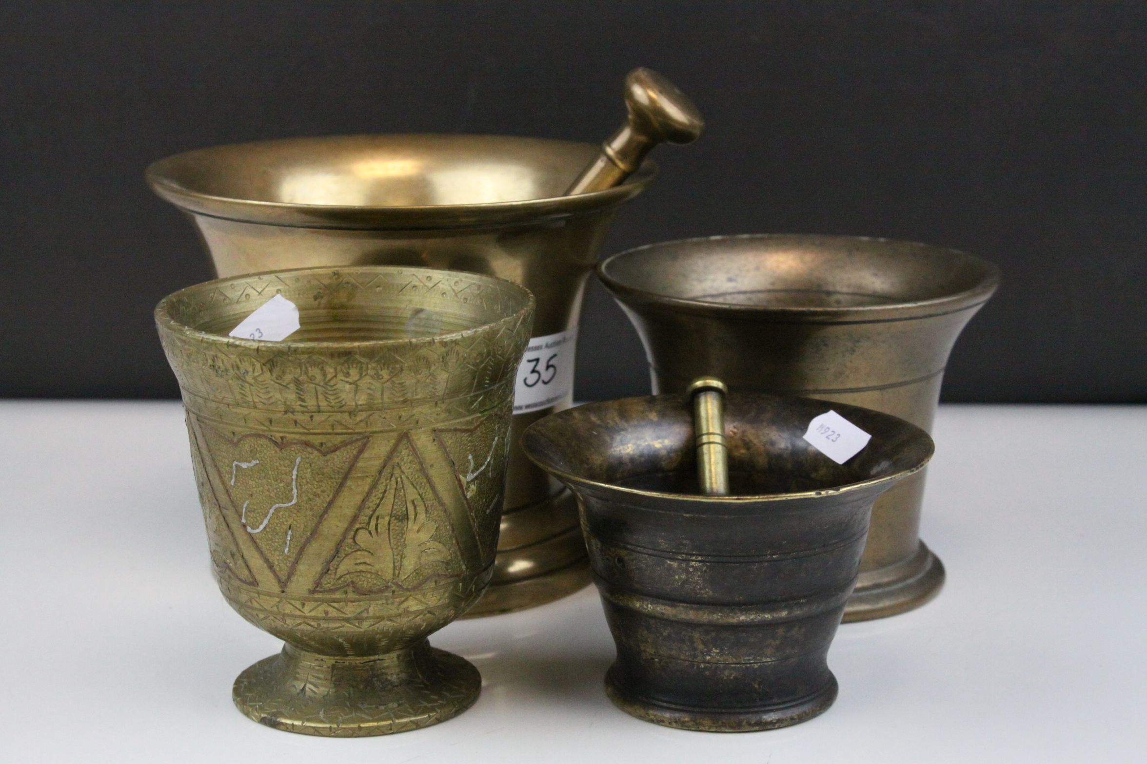 Large 19th century Brass / Bell Metal Pestle and Mortar, 17cms diameter together with another Bell