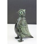 A bronze lidded vessel in the form of a stylized bird.