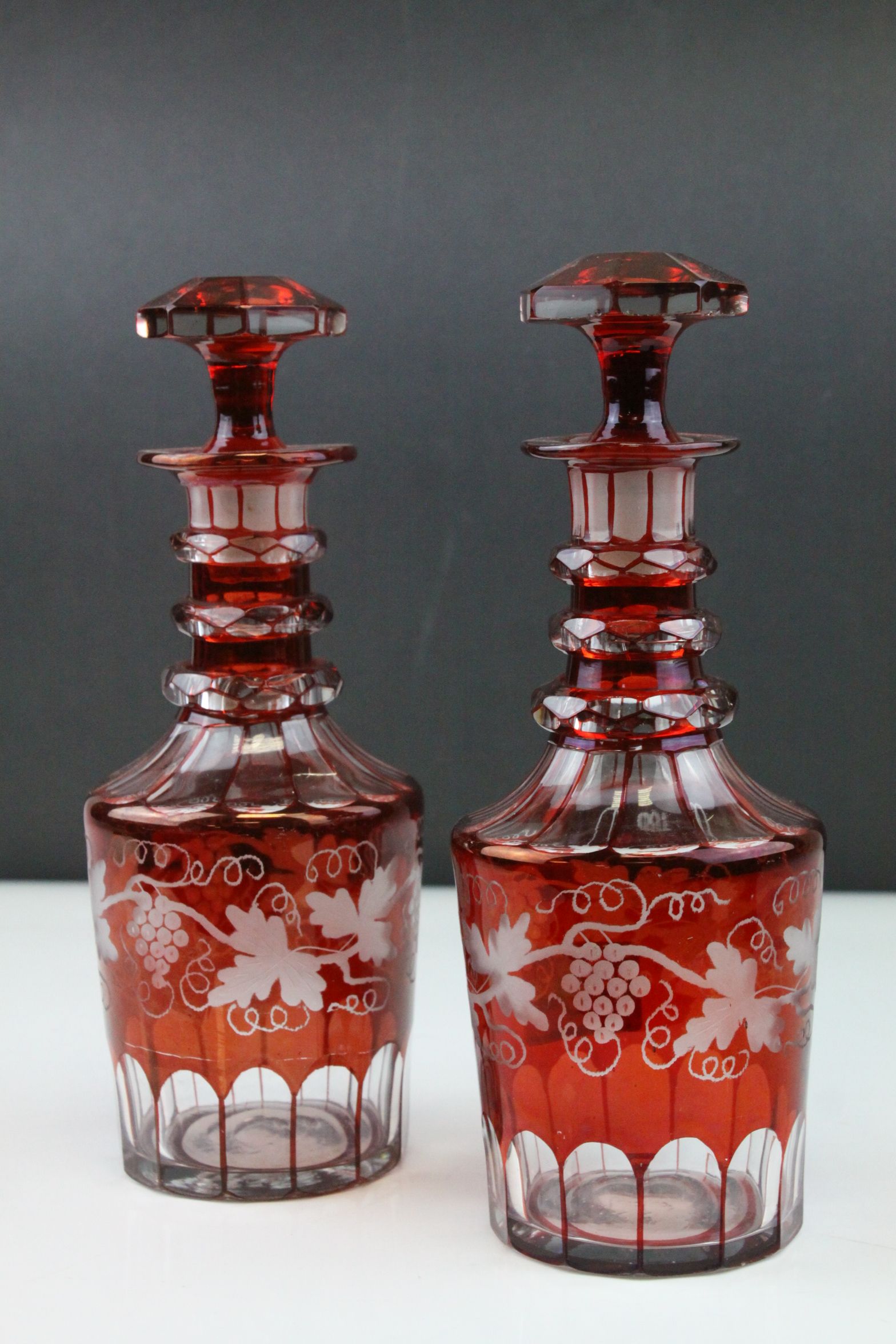 Pair of 19th century Bohemian Red Decanters with etched leaf and vine decoration, 24cms high