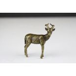 A brass/bronze figure of a antelope.
