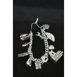 Silver curb link padlock clasp charm bracelet with ten silver charms