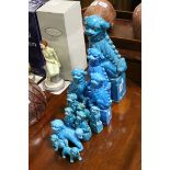 Twelve oriental blue ground Dogs of Foo figures.
