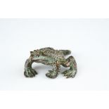 A bronze figure of a Toad.