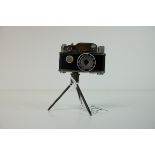 Early 20th century Novelty Table Lighter in the form of a Camera stood on a Tripod Base, 9.5cms