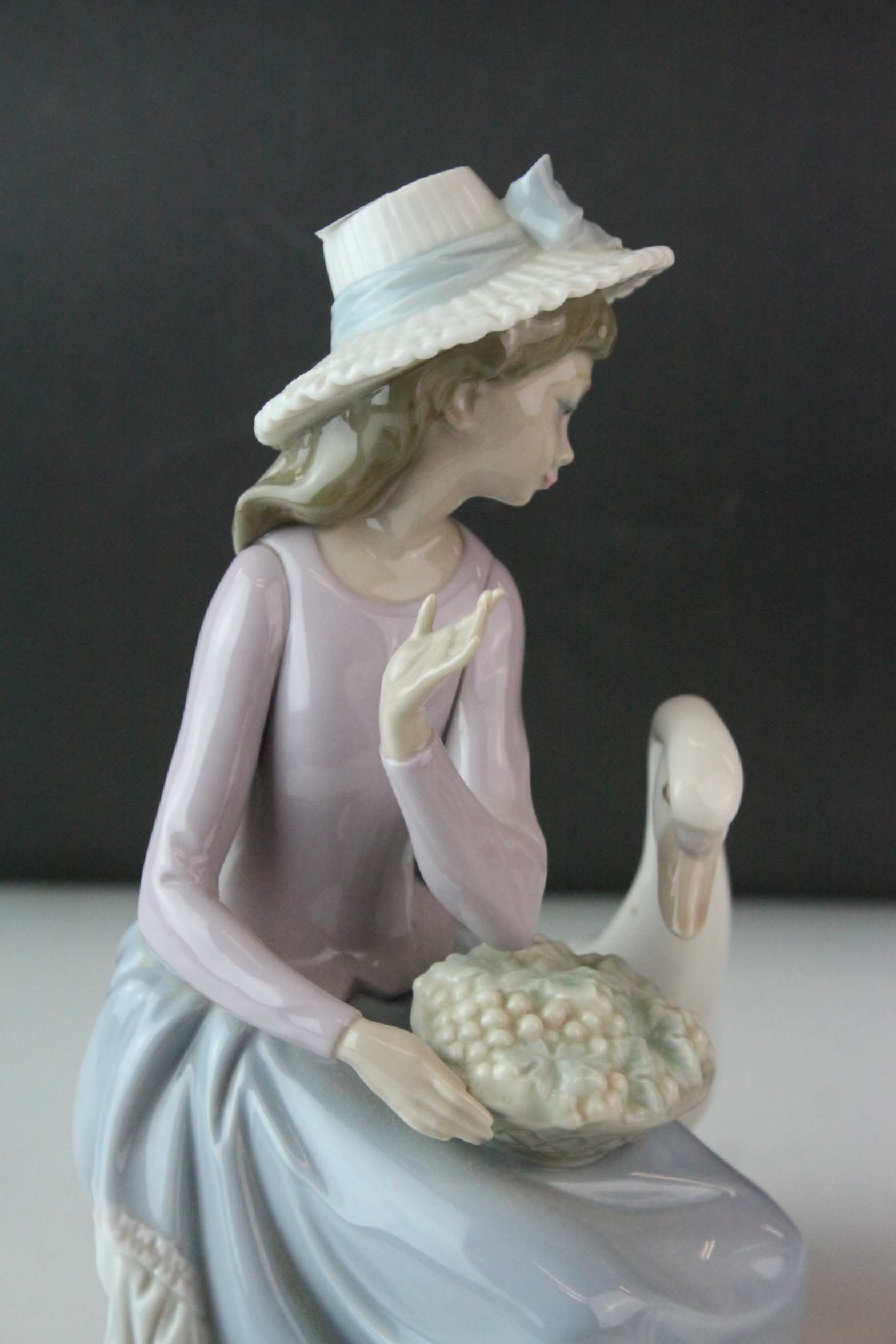 Two Lladro Figures, Caress and Rest, model no. 1245, 21cms high and a Seated Girl holding Flower - Image 4 of 10